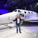 Sir Richard Branson poses in front of Virgin Galactic’s SpaceShipTwo space tourism rocket after it was unveiled, Friday, Feb. 19, 2016, in Mojave, Calif.